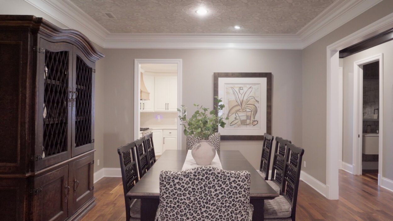 An elegant dining room in Clayton, MO that has been professionally staged with decor and artwork.